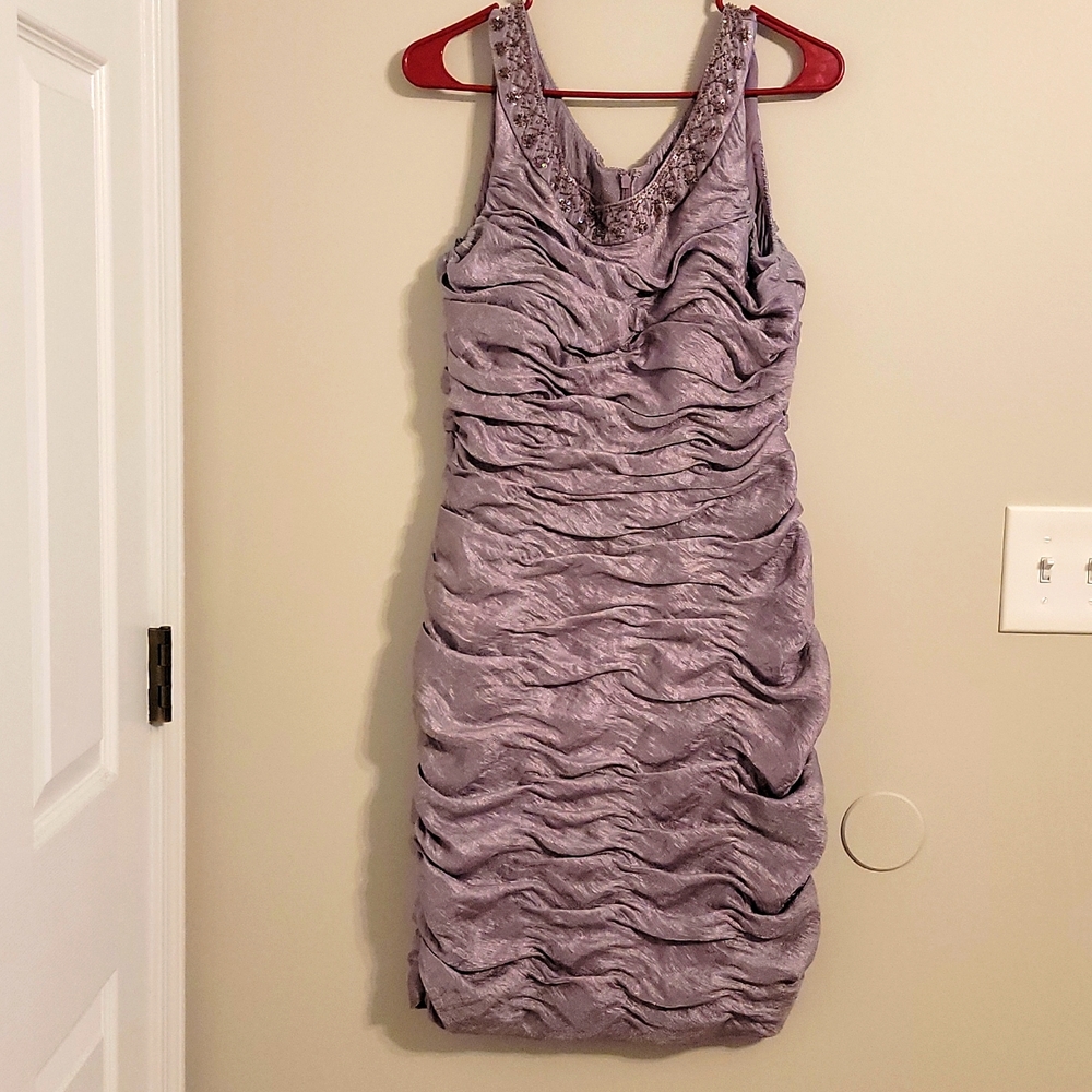 Bodycon Rouched, form fitting dress With beadwork/embellishments along collar